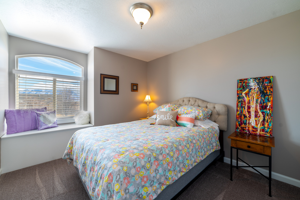 Bedroom Interior Design With Floral Print On Bed Linen